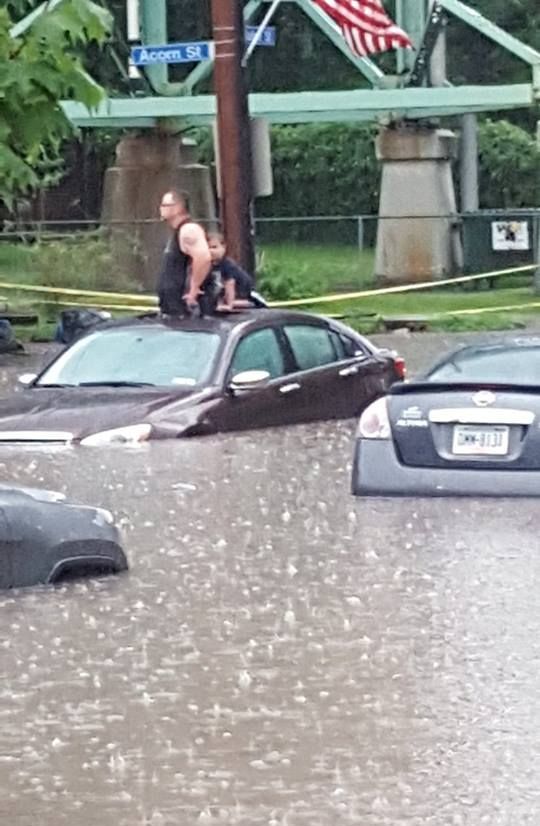 Father and son stranded in their car during flash flood in The Run, 28 Aug 2016 (photo by Justin Macey)