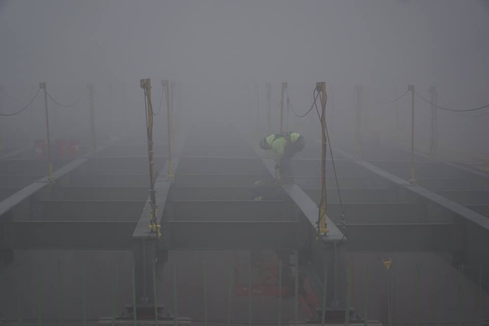 Worker on the Greenfield Bridge, in fog (photo by Pat Hassett)